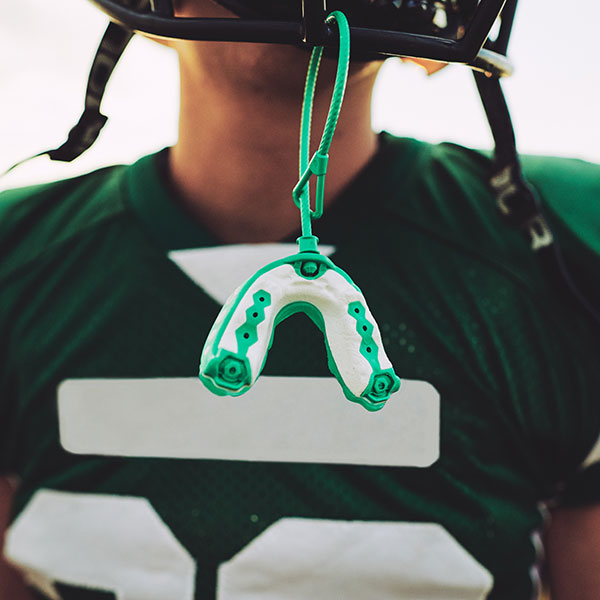 Young Man Wearing an Athletic Mouthguard