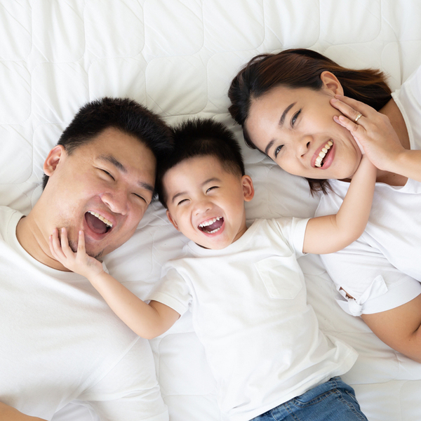 Family of Three on Bed