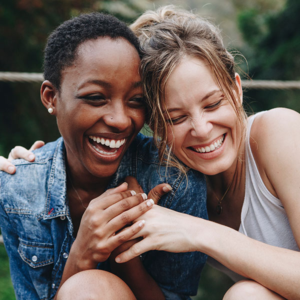 Two Woman Laughing Outdoors